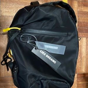 Like dream black nylon with gold strap backpack/purse.